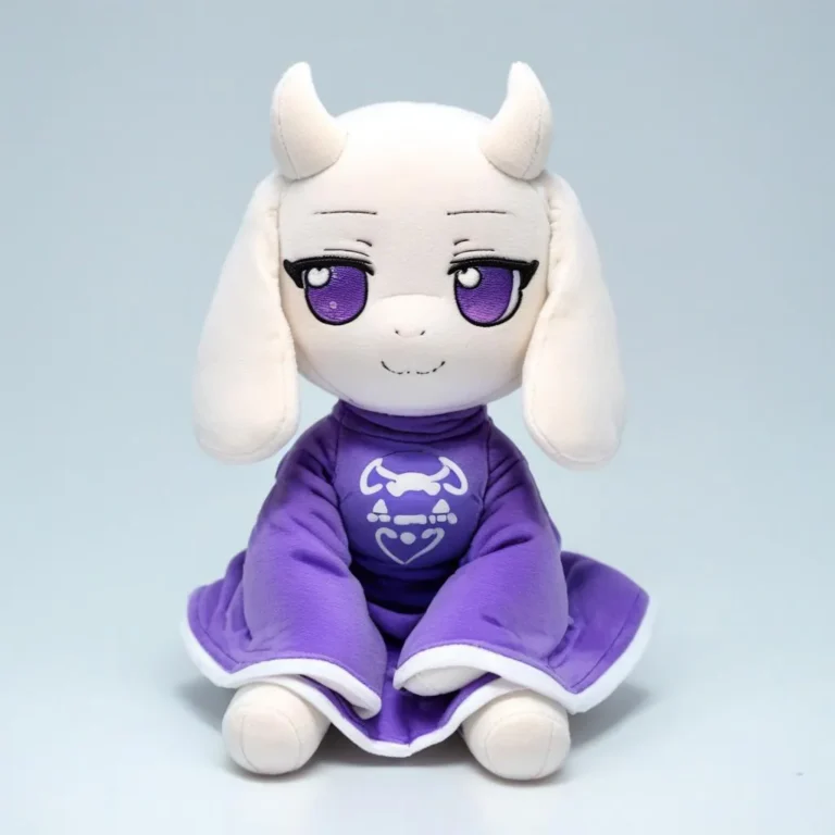 A Fumo plush doll resembling Toriel with purple robes and eyes, white fur, horns, and a smug expression against a black background.